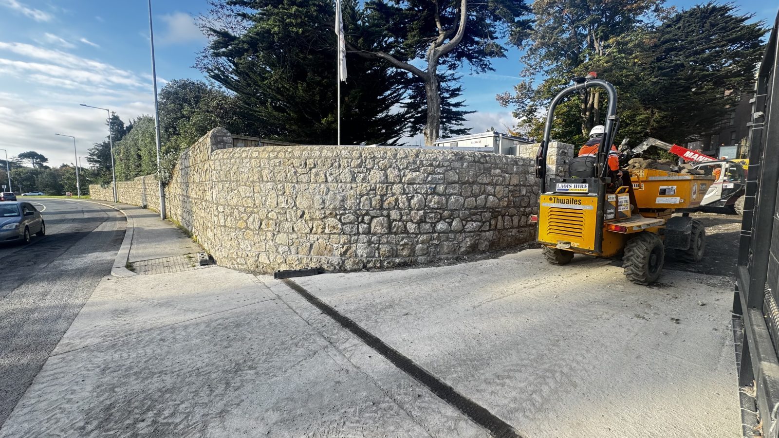 Curved granite boundary wall along the road, Dublin