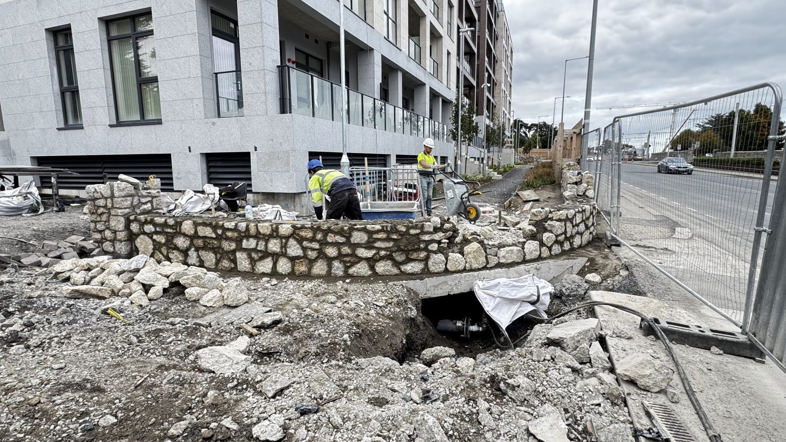 Granite boundary wall under construction, Dublin