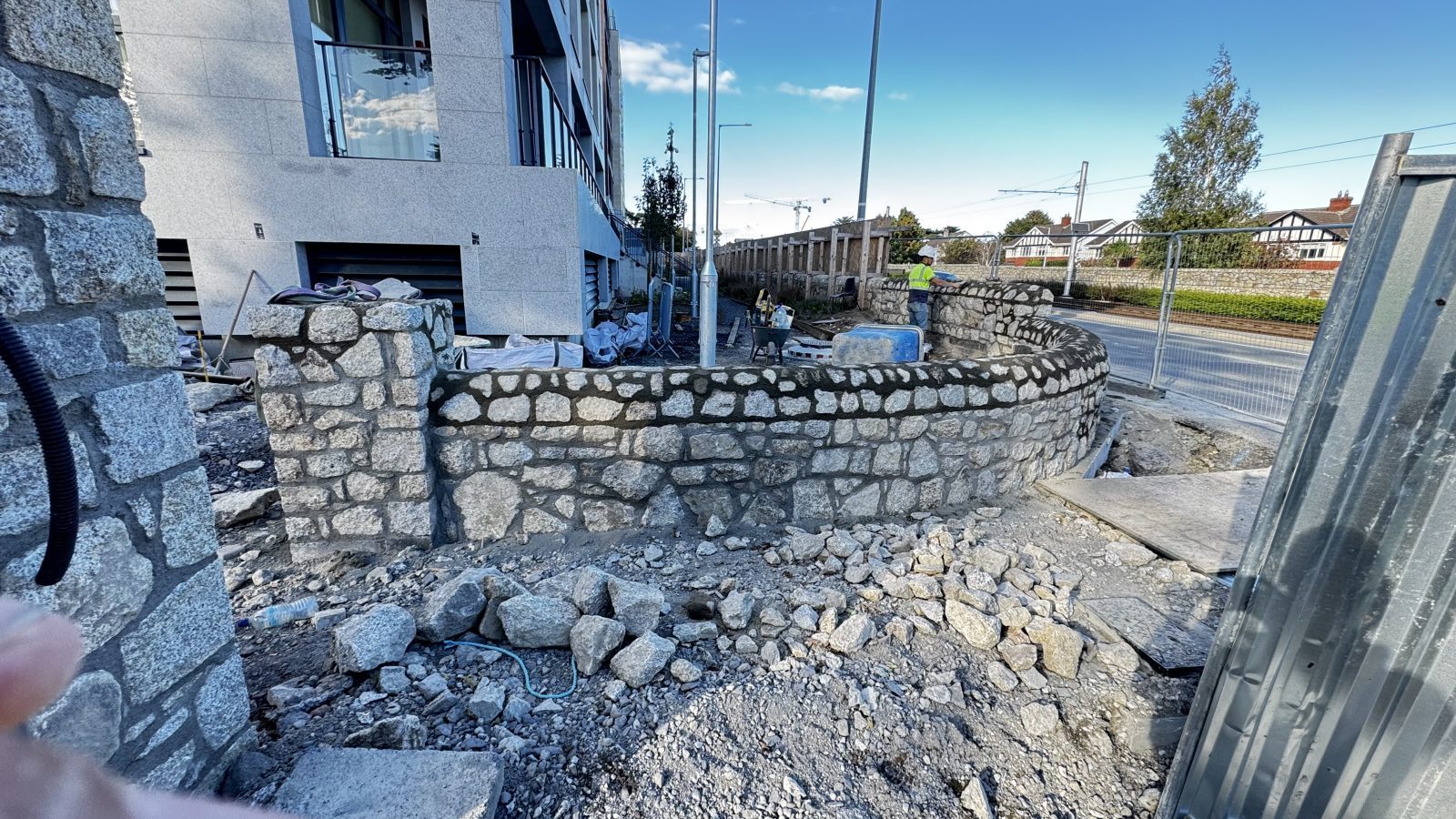 Granite rubble wall being built by hand, Dublin