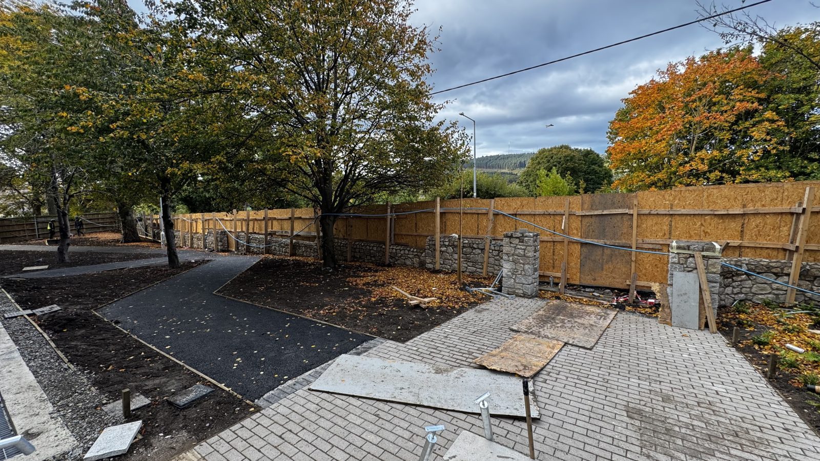 Finished granite boundary wall with stone pillar and new landscaping, Dublin
