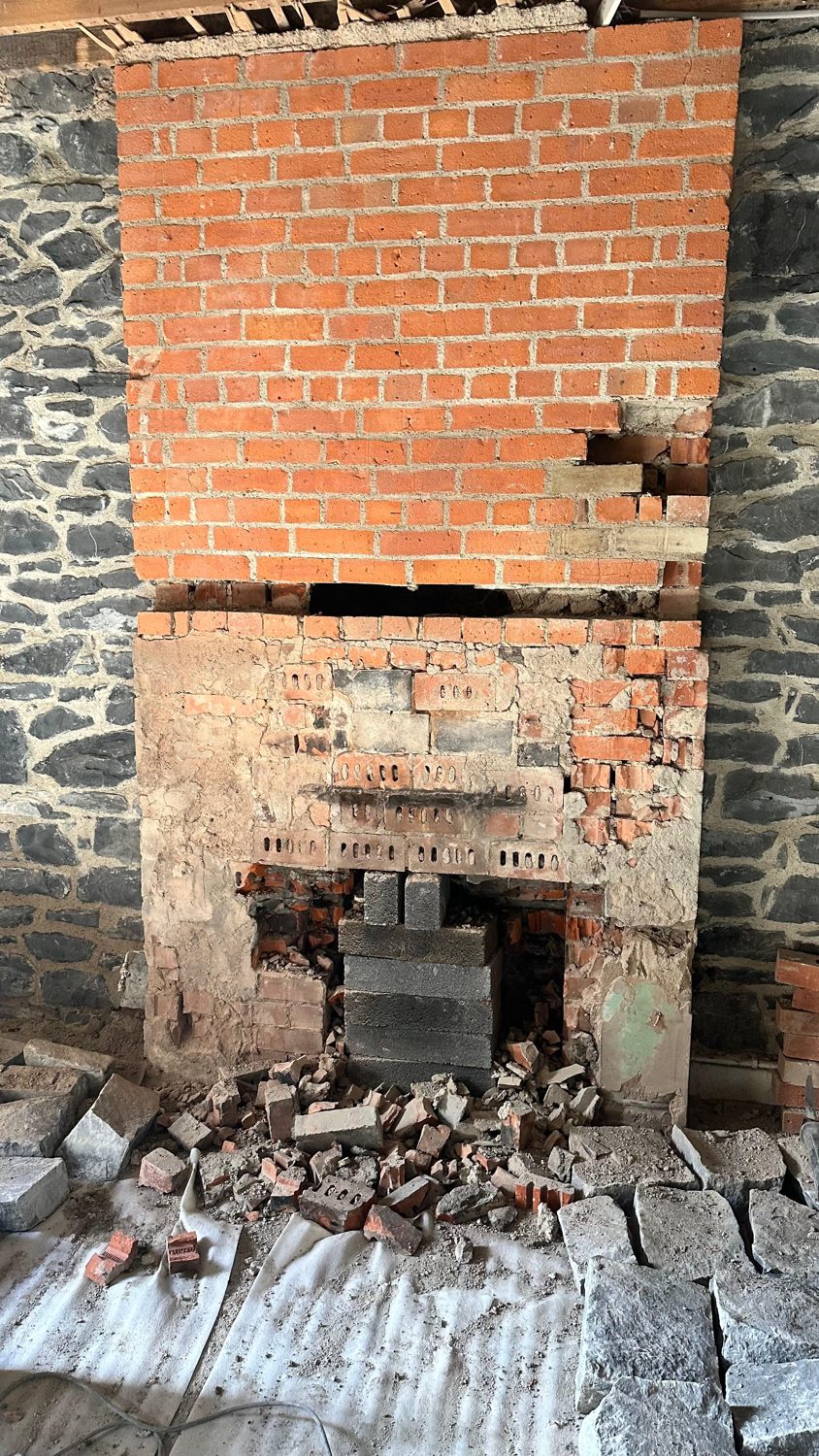 Swords cottage restoration — brick fireplace opening under construction