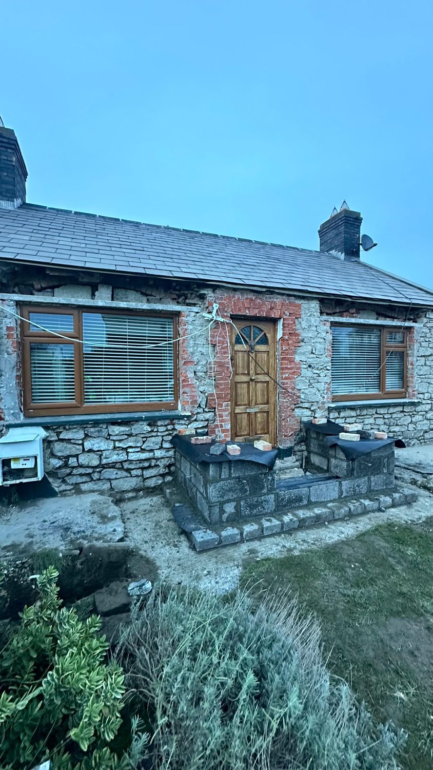 Fully restored stone cottage exterior in Swords, Co Dublin by L&A Building Experts