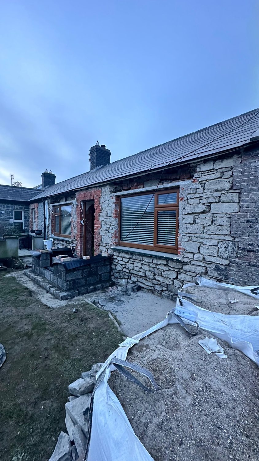 Swords cottage restoration — finished front elevation at dusk