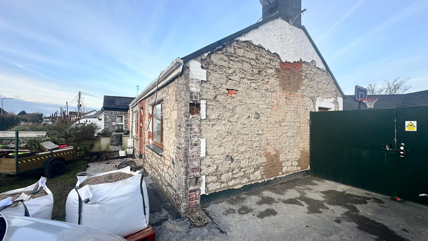 Old cement-rendered stone cottage in Swords, Co Dublin before restoration by L&A Building Experts