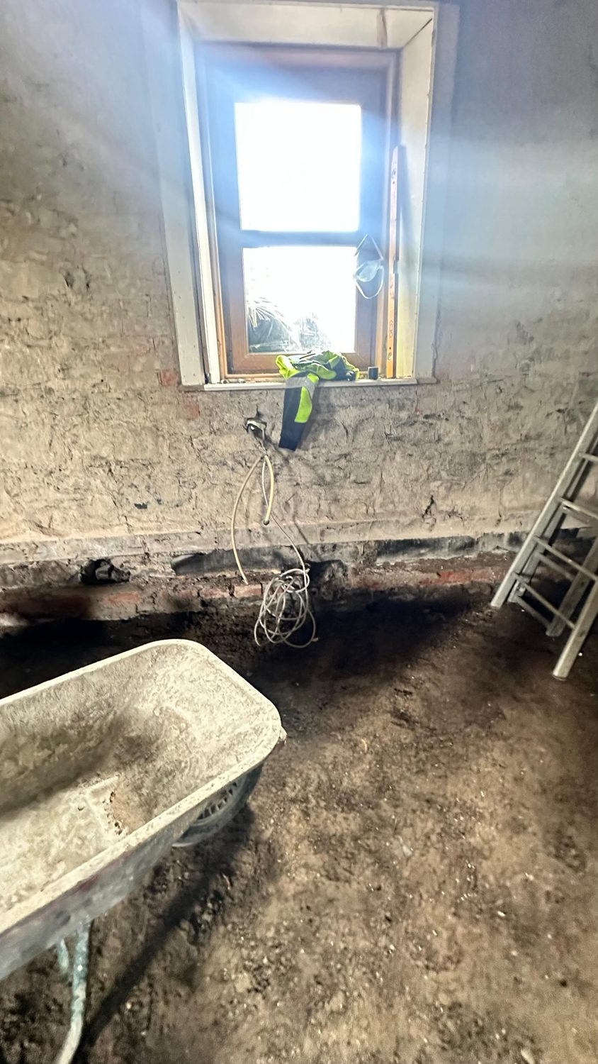 Stone cottage stripped back to bare masonry for structural repair, Swords Dublin
