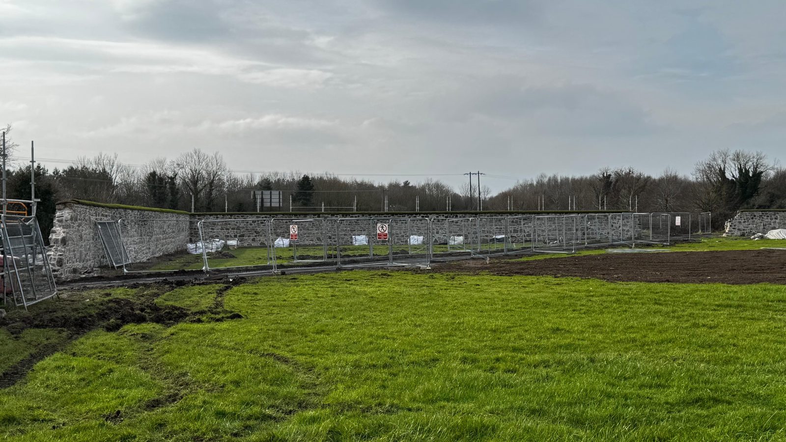 The Wonderful Barn Leixlip — boundary wall across the field during works