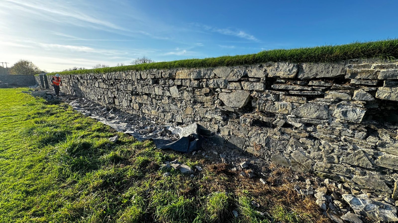 Restored historic boundary wall repointed in lime with grassed coping, The Wonderful Barn, Leixlip